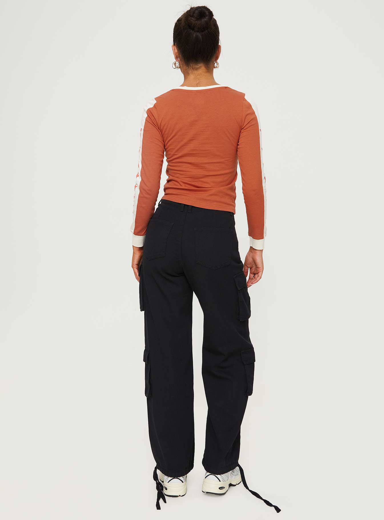 back view of model wearing Princess Polly Driscoll Cargo Pants Washed Black Mid Rise 