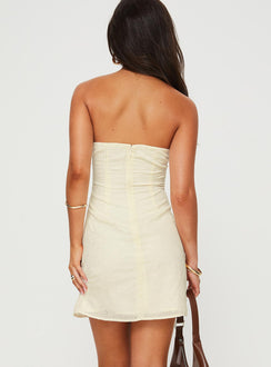 back view of model wearing Princess Polly Malena Strapless Mini Dress Lemon Sweetheart Neckline 