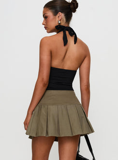 back view of model wearing Princess Polly Feodora Pleat Mini Skirt Khaki Mini Skirts 