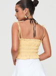 back view of model wearing Princess Polly Sars Top Yellow Sleeveless Square Neck 