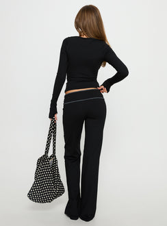back view of model wearing Princess Polly Kobee Jersey Flare Pants Black / Grey Mid Rise Pants 