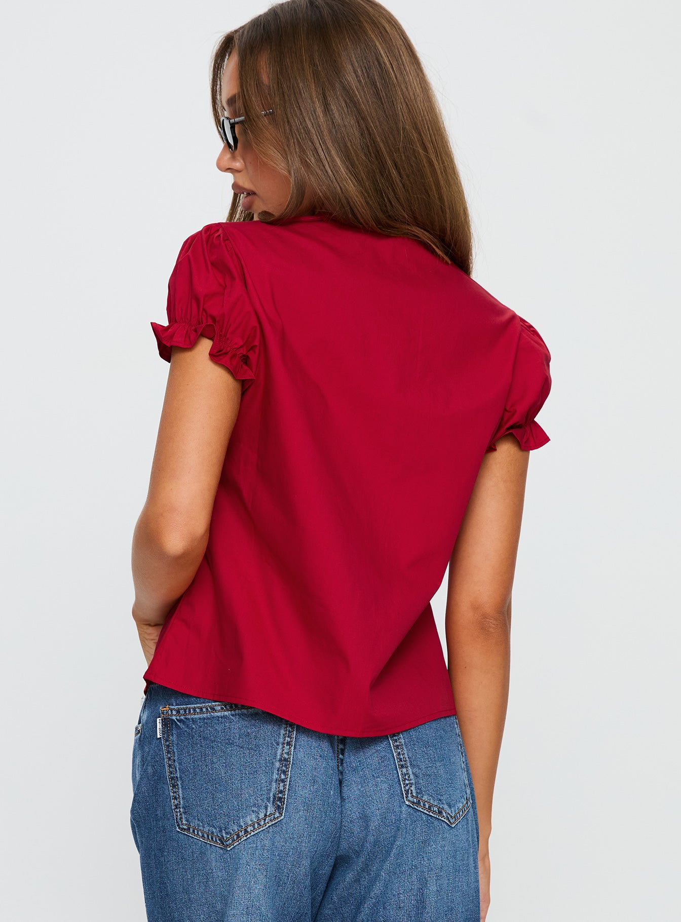 back view of model wearing Princess Polly Starstruck Tie Up Top Red Short Sleeves V-Neck 