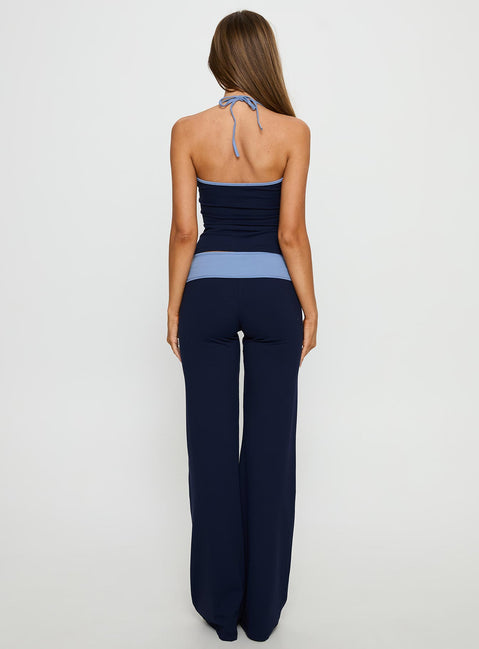back view of model wearing Princess Polly Kobee Jersey Flare Pants Navy / Light Blue High Rise Pants 