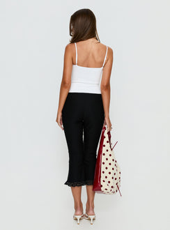 back view of model wearing Princess Polly Darsie Frill Capri Black Polka Dot High Rise Pants 