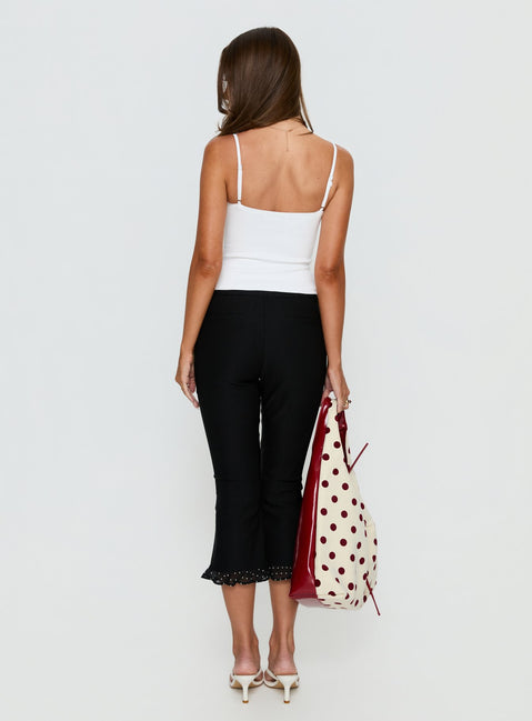 back view of model wearing Princess Polly Darsie Frill Capri Black Polka Dot High Rise Pants 