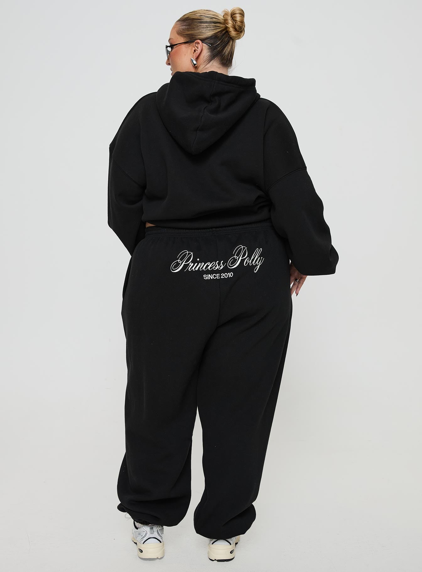 back view of model wearing Princess Polly Princess Polly Track Pants Script Black / Ivory Curve 