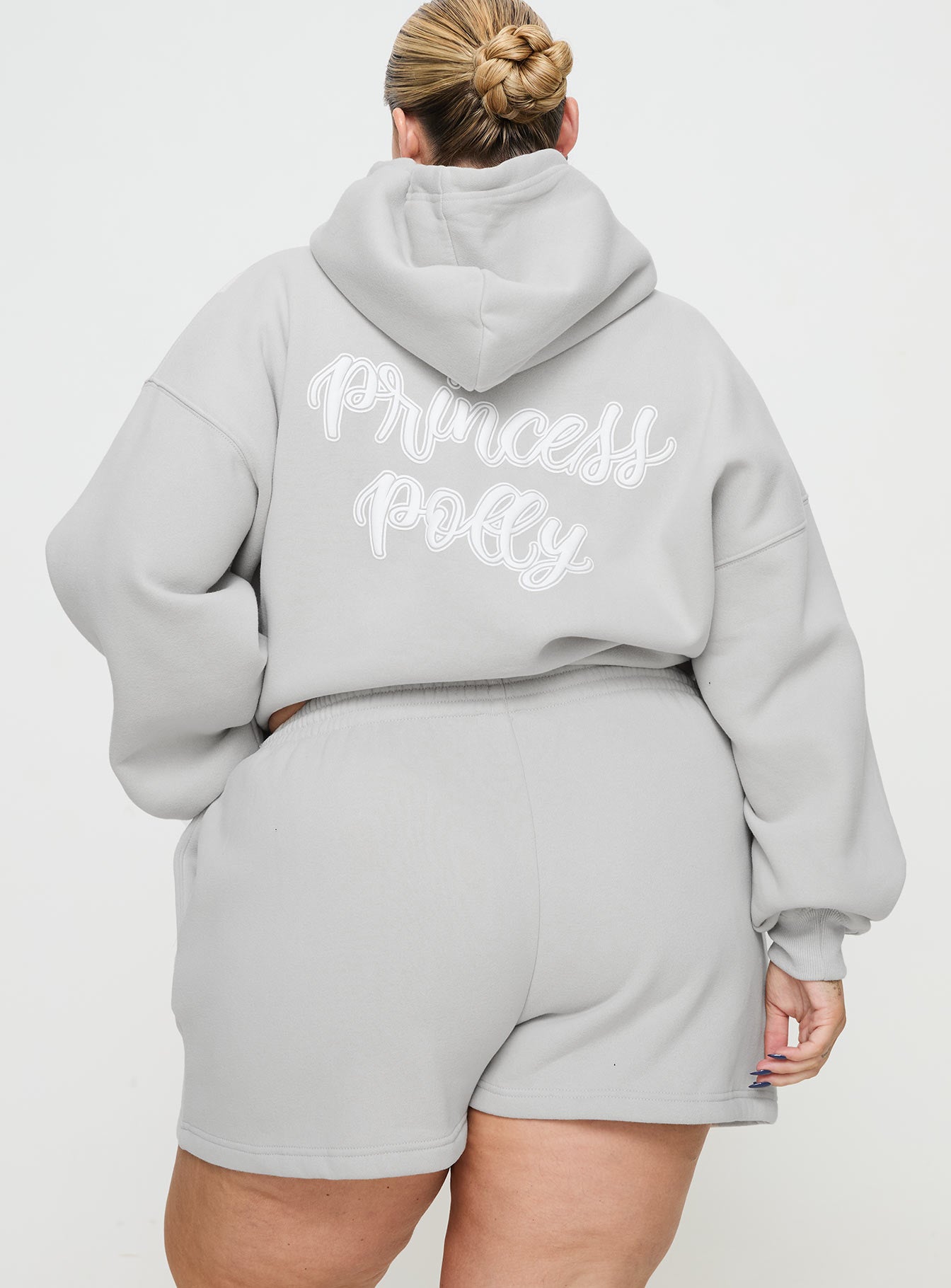 back view of model wearing Princess Polly Princess Polly Track Shorts Puff Text Grey Curve 