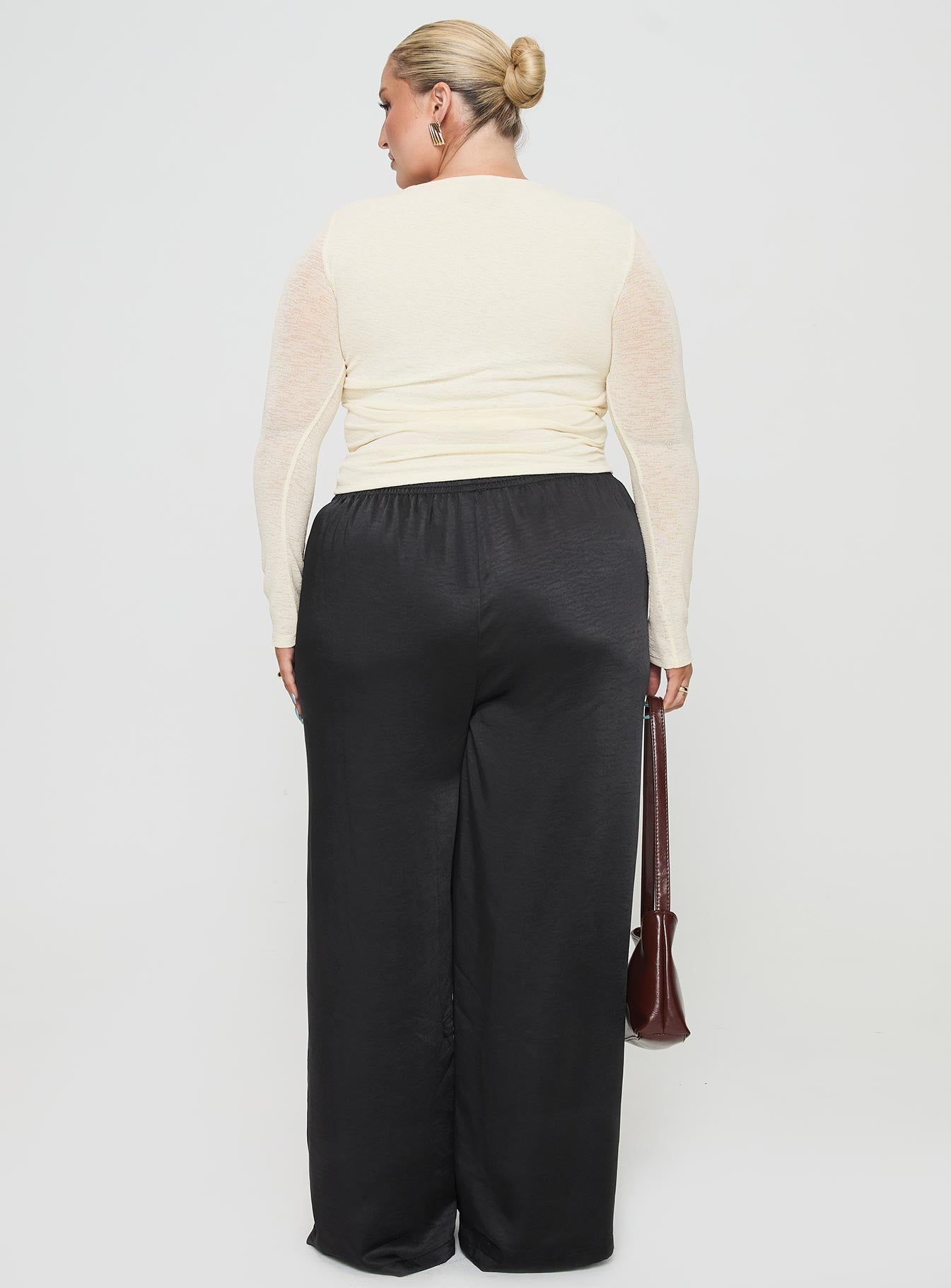 back view of model wearing Princess Polly Nixie Pants Black Curve mid-risedeselected 