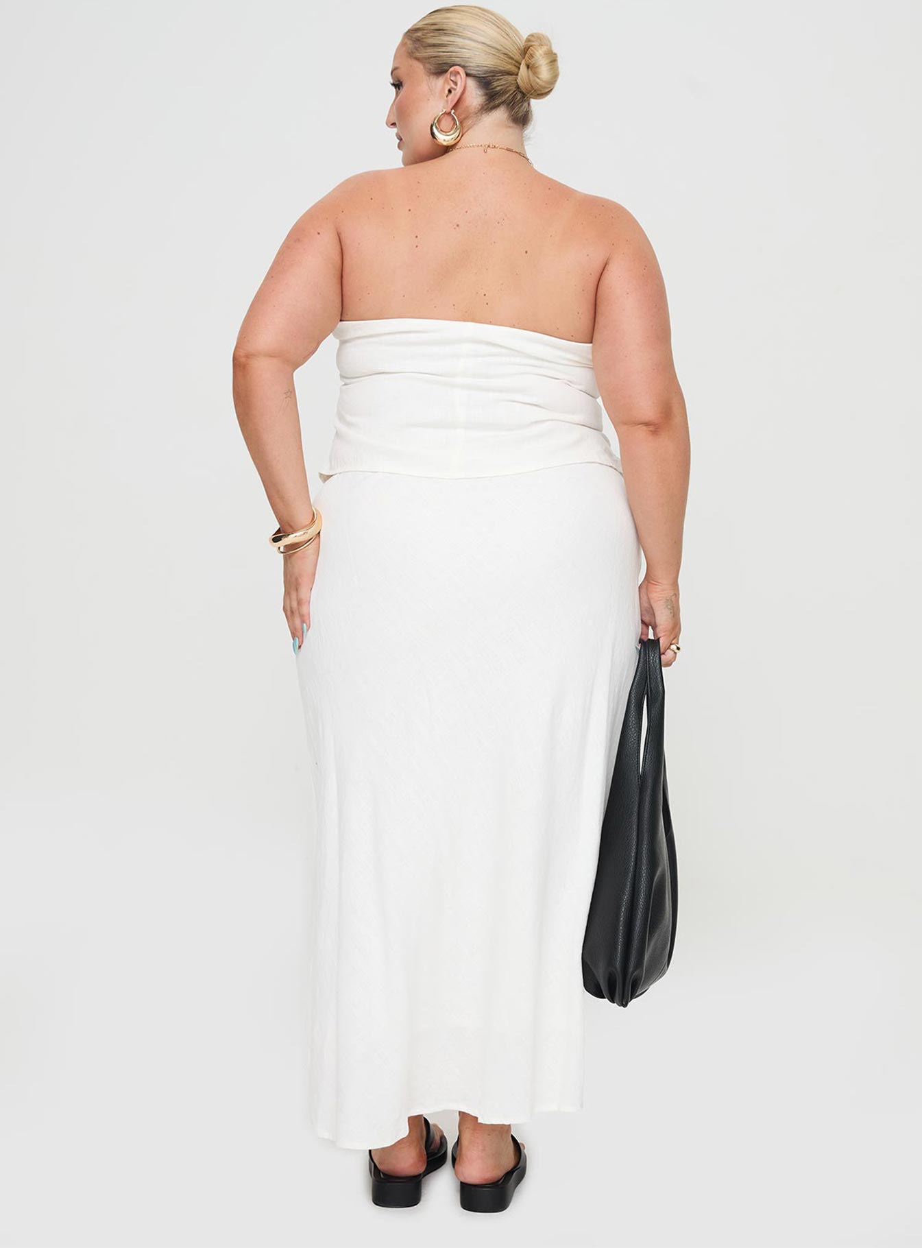 back view of model wearing Princess Polly Ermias Linen Blend Midi Skirt White Curve Maxi 