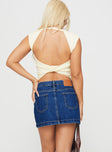 back view of model wearing Princess Polly Nickei Denim Mini Skirt Mid Wash Lower Impact Mini Skirts 