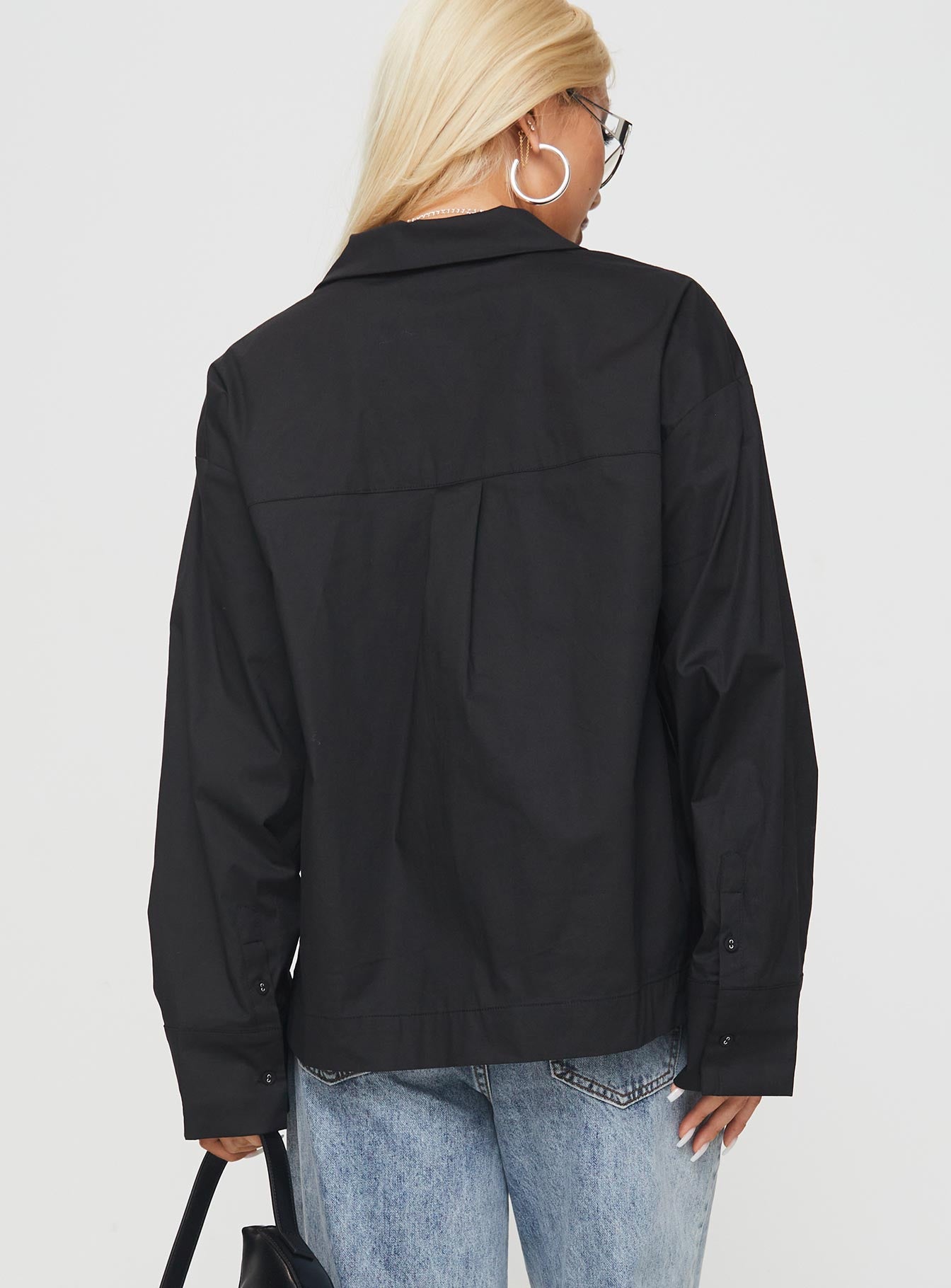 back view of model wearing Princess Polly Spiri Shirt Black Full Sleeves V-Neck 