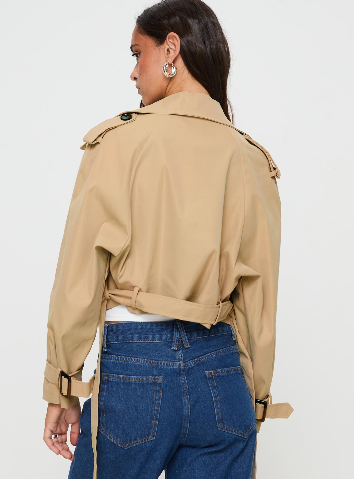 Beige Cropped trench coat Lapel collar, button fastening at front, adjustable & removable belt at waist & cuffs