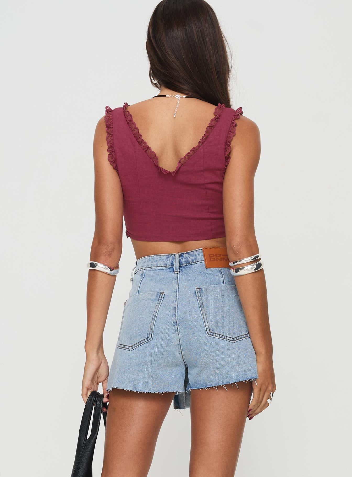 back view of model wearing Princess Polly Josue Denim Wrap Skort Light Blue Wash High Waisted Shorts 