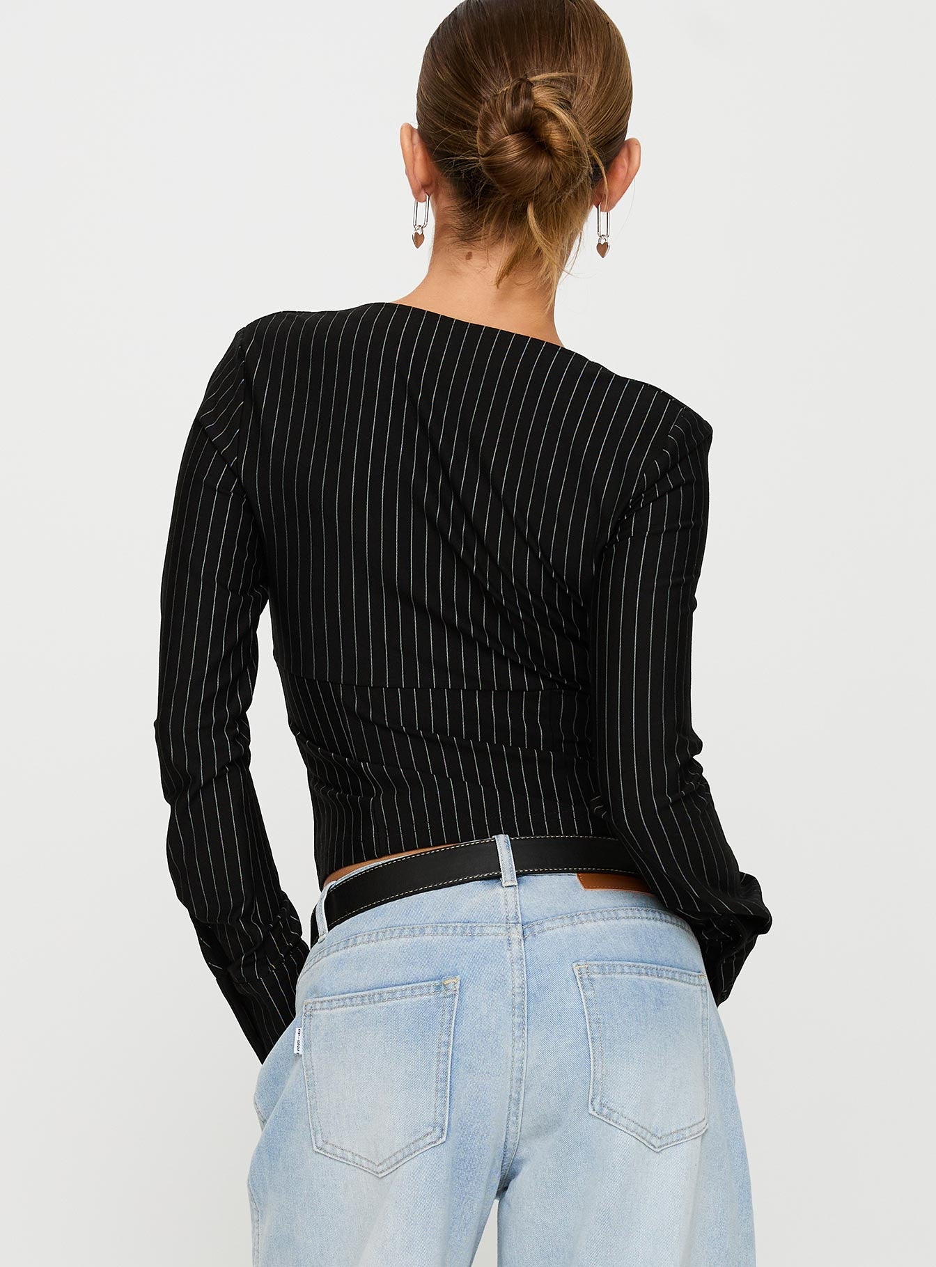 back view of model wearing Princess Polly Set For Life Foldover Detail Long Sleeve Top Black / White Pinstripe Full Sleeves V-Neck 
