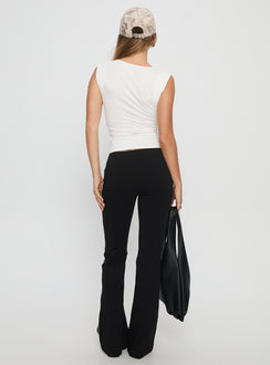 back view of model wearing Princess Polly Simki Jersey Flare Pants Black Low Rise Pants 