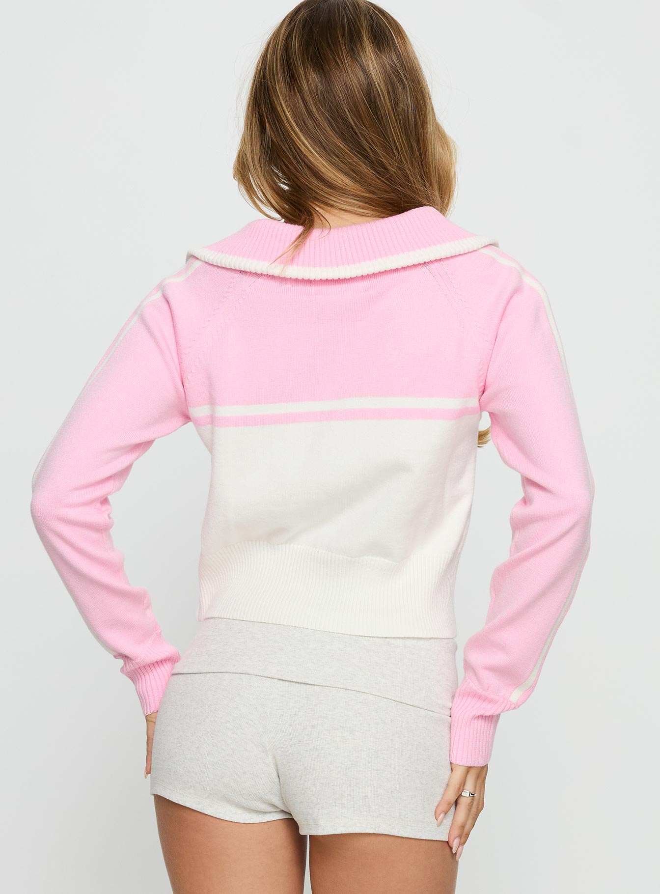 back view of model wearing Princess Polly Take The Lead Zip Through Knit Sweater Pink / White Cropped 