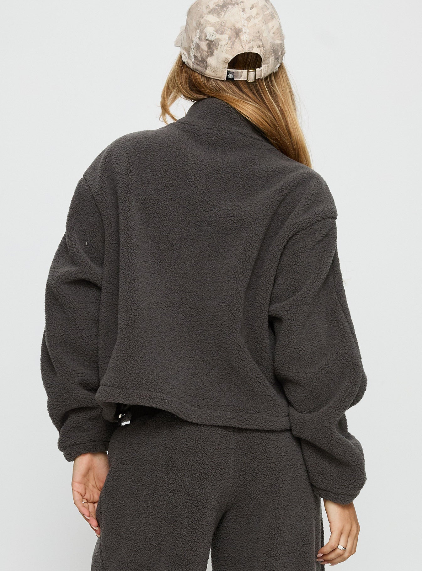 back view of model wearing Princess Polly Siberia Fleece Zip Up Jumper Charcoal regular 