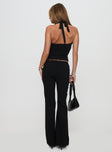 back view of model wearing Princess Polly En Route Pants Black Low Rise Pants 