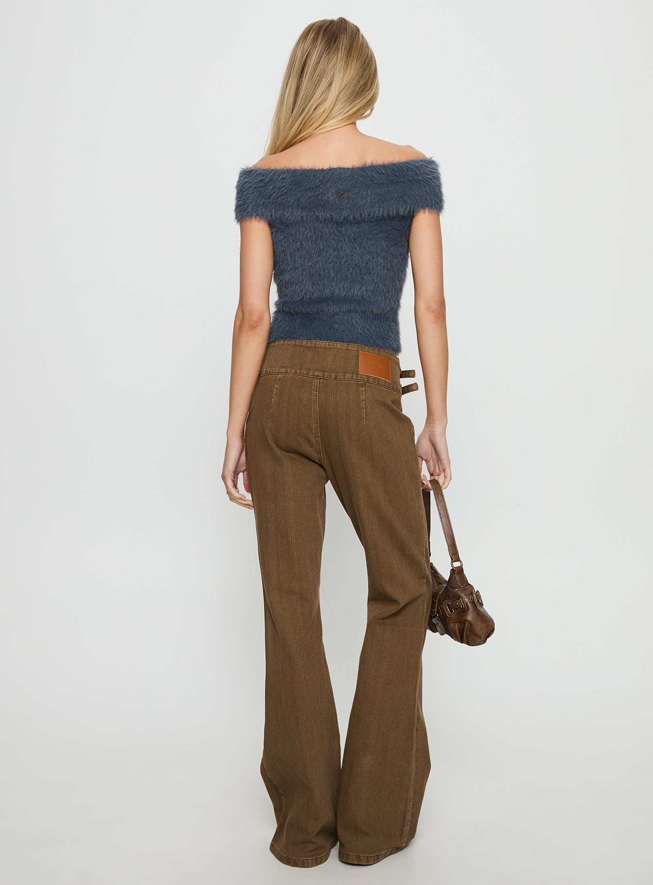 back view of model wearing Princess Polly Thrill Ride Mid Rise Corduroy Flare Jeans Washed Brown Mid Rise Jeans 