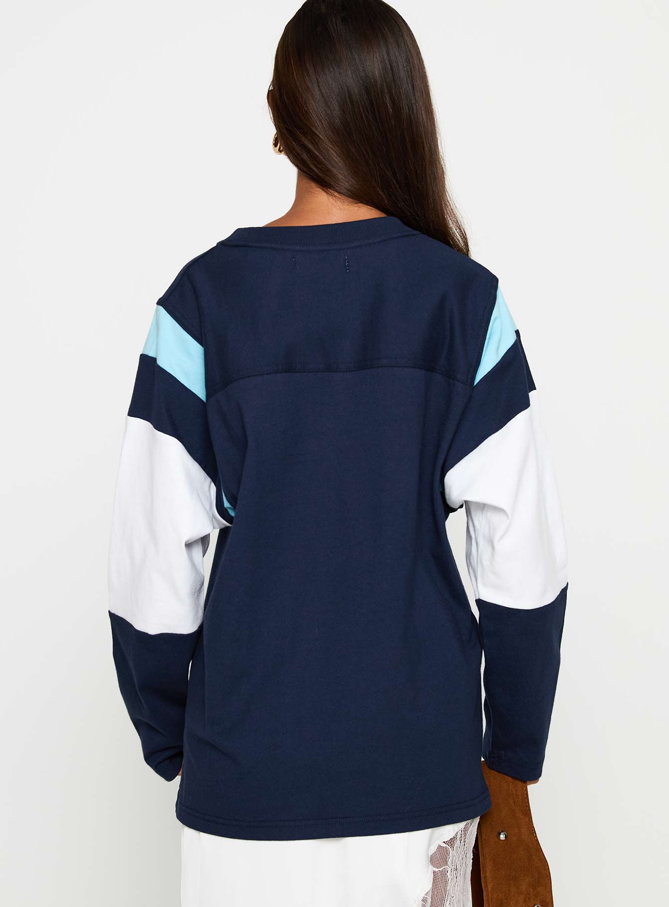 back view of model wearing Princess Polly Collegiate Queen Long Sleeved Top Navy Full Sleeves Crew Neck 