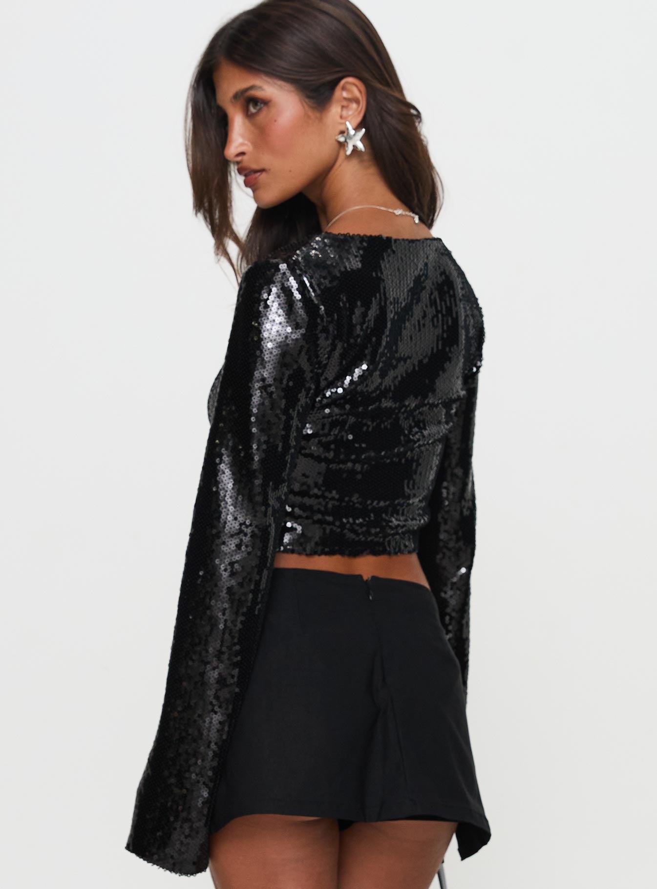 back view of model wearing Princess Polly Zenobia Long Sleeve Sequin Top Black Full Sleeves Scoop Neck 