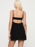 back view of model wearing Princess Polly Granno Mini Dress Black Sweetheart Neckline 