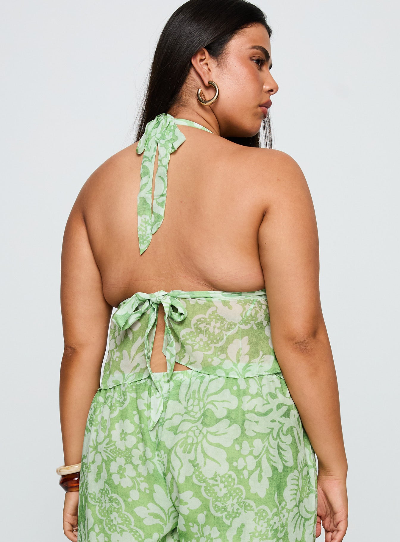 back view of model wearing Princess Polly Finesse Halter Top Green Floral Curve Sleeveless Square Neck 