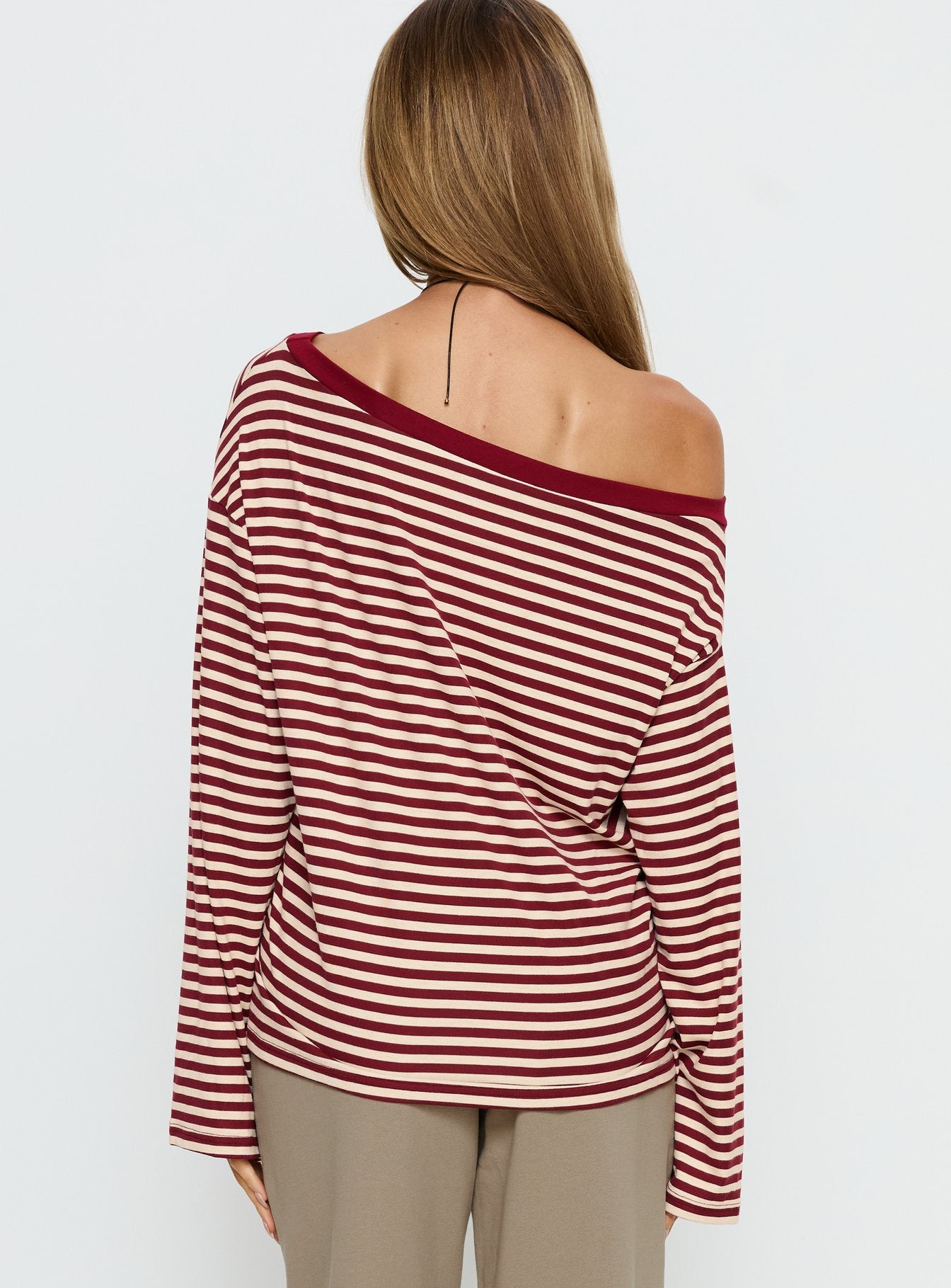 back view of model wearing Princess Polly Ralyssa Off Shoulder Long Sleeve Top Red Stripe Longline Jumpers 