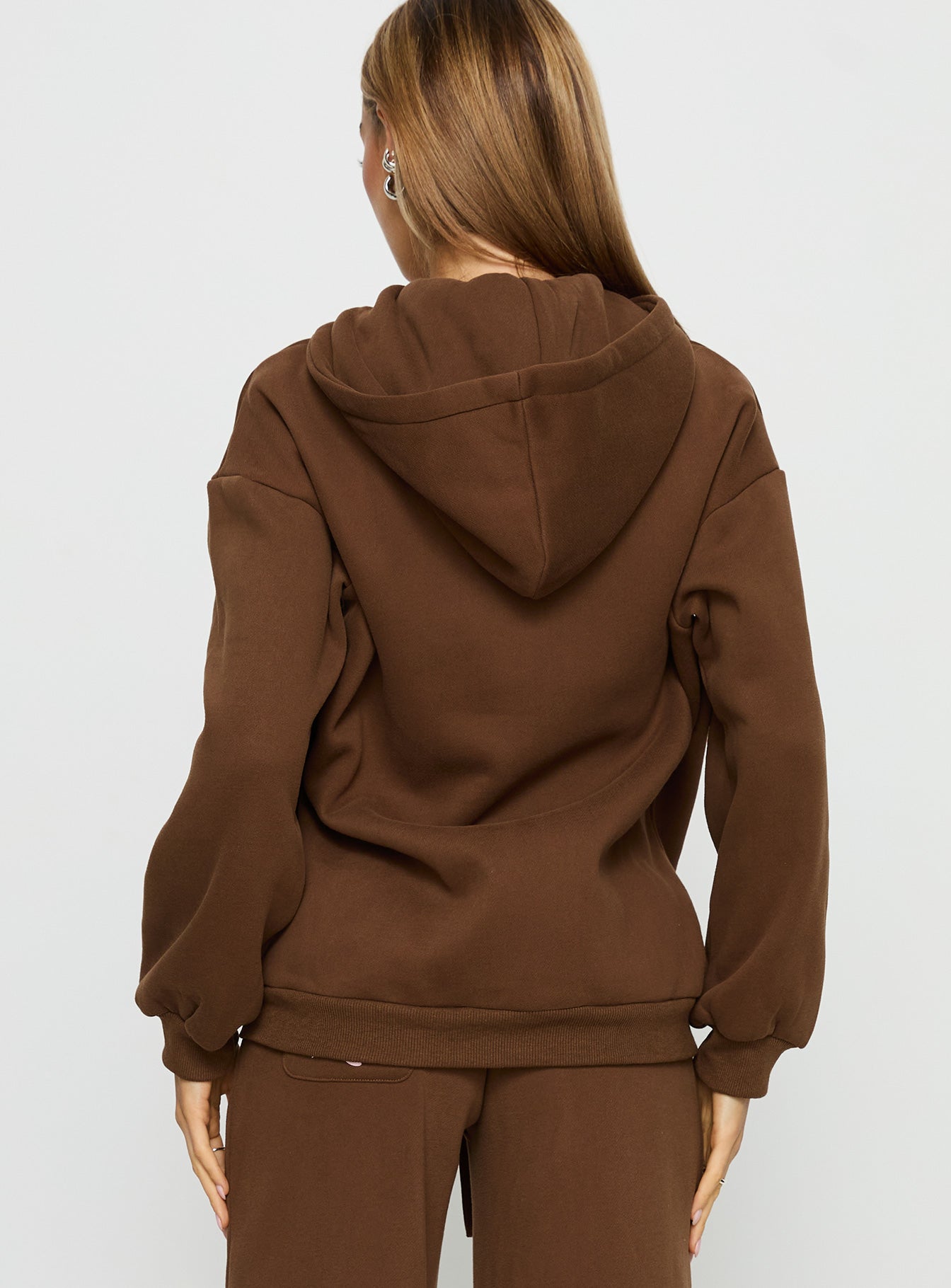 back view of model wearing Princess Polly Princess Polly Stargirl Zip Through Jumper Brown Longline Jumpers 