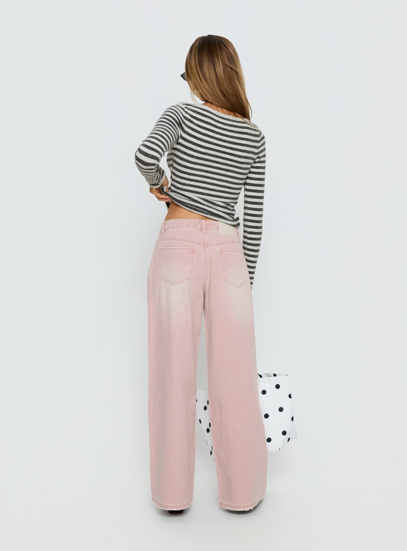 back view of model wearing Princess Polly Lucky Dip Mid Rise Straight Leg Jeans Washed Pink Mid Rise Jeans 