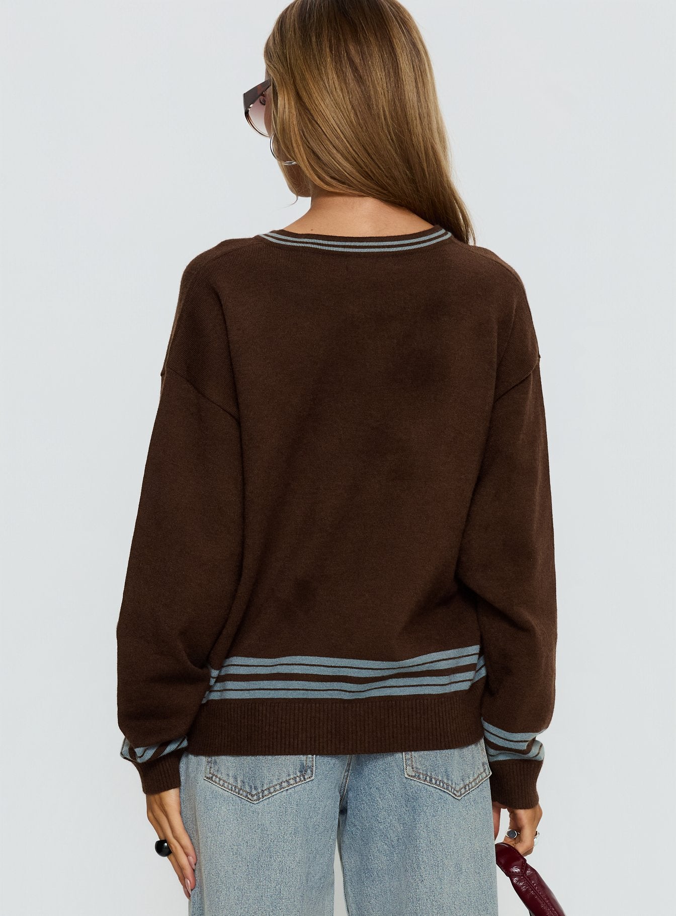 back view of model wearing Princess Polly Yarnia V Neck Jumper Brown / Blue regular 