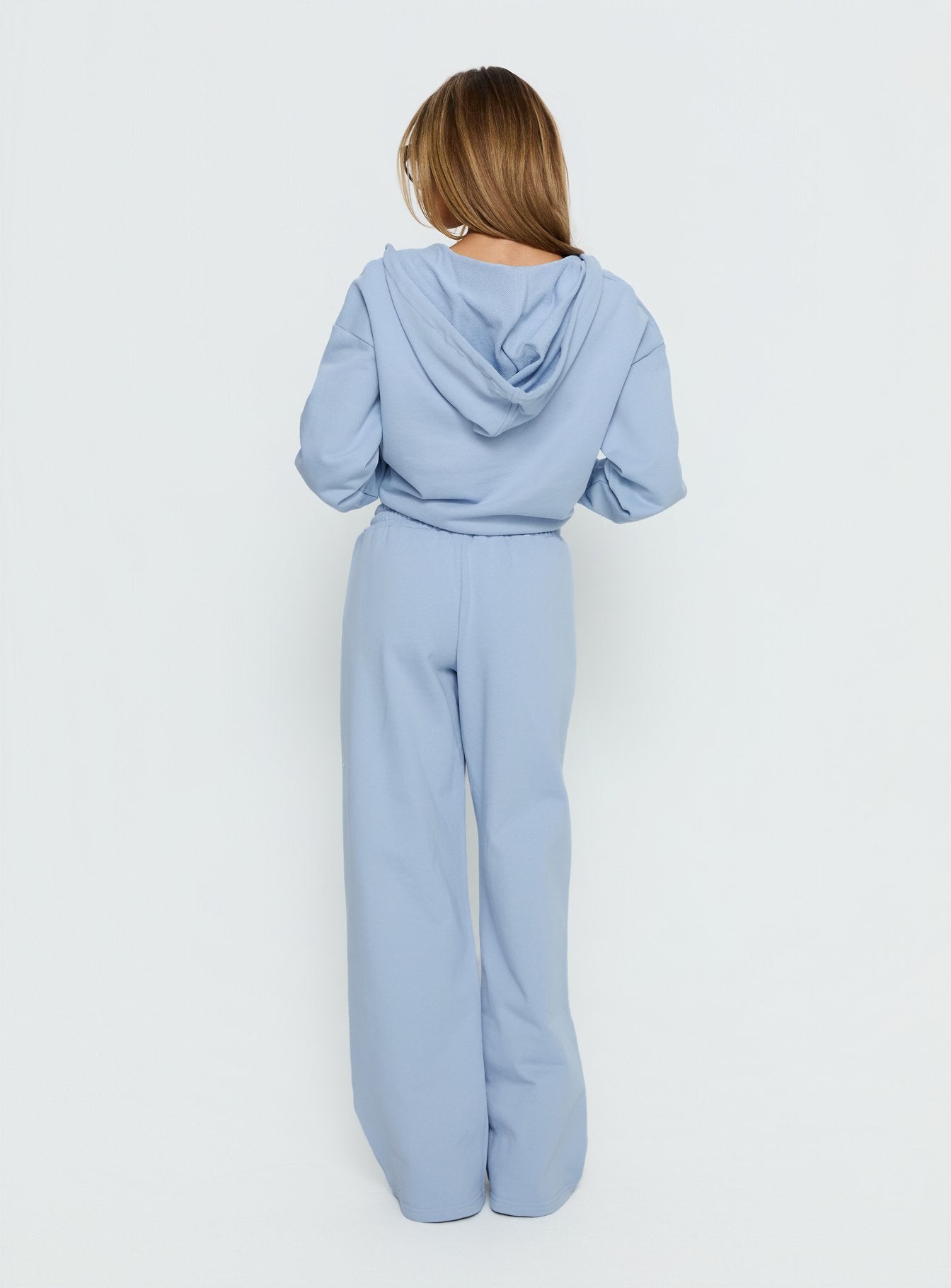 back view of model wearing Princess Polly All Day Straight Leg Sweatpants Icy Blue Mid Rise Pants 