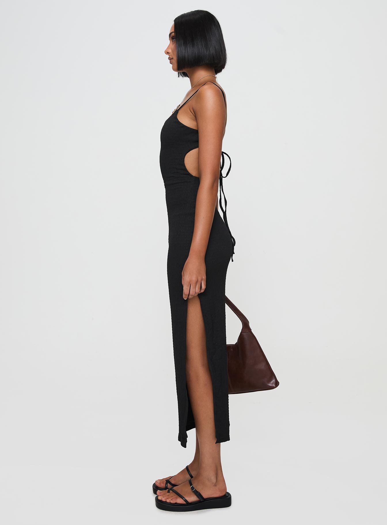 side view of model wearing Princess Polly Elestria Maxi Dress Black Scoop Neck 