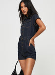 Dark wash denim romper Classic collar, button fastening at front, twin chest & hip pockets, belt looped waist, back pockets