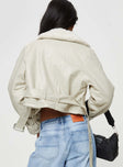 Cropped jacket Faux leather material, oversized collar, removable belts at waist and cuff, buckle fastening