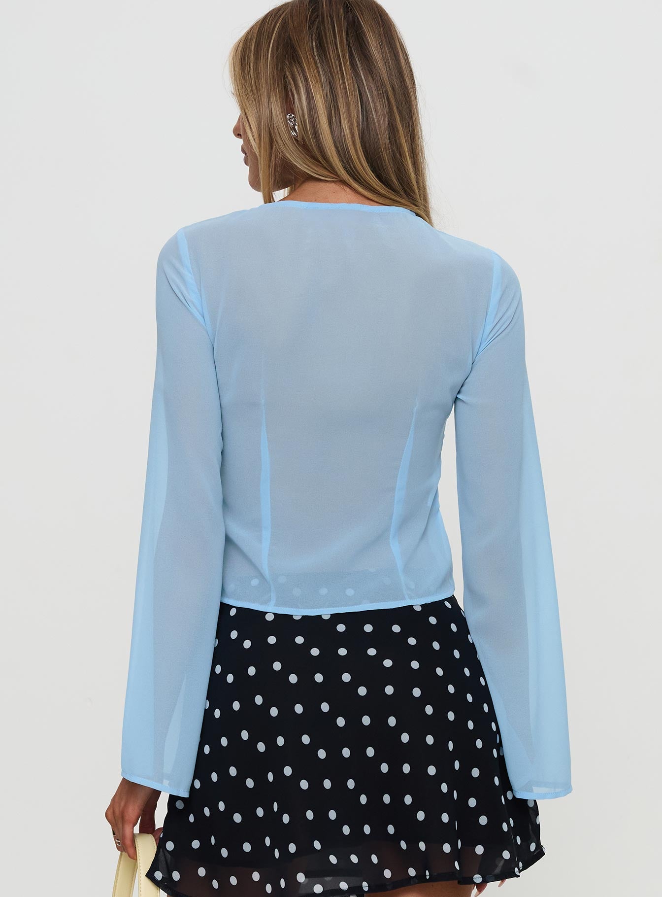 back view of model wearing Princess Polly Coates Long Sleeve Top Blue Full Sleeves Crew Neck 