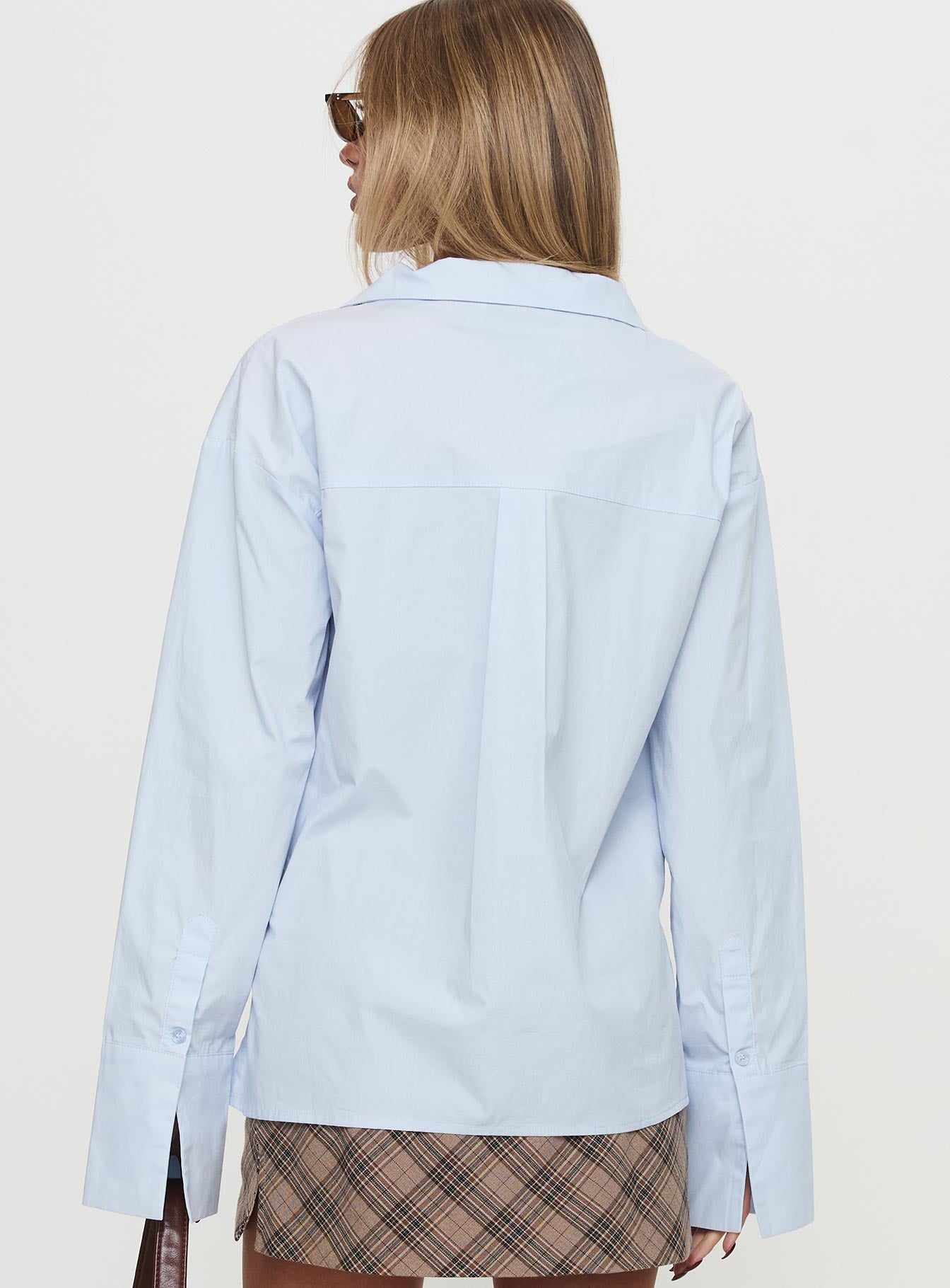 back view of model wearing Princess Polly Calistoga Deep Collar Shirt Blue Full Sleeves V-Neck 