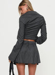 back view of model wearing Princess Polly Saraya Pleat Mini Skort Grey Pinstripe High Waisted Shorts 