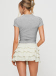 back view of model wearing Princess Polly Match Point Mini Skort Porcelain Low Rise Shorts 