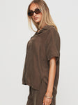 side view of model wearing Princess Polly Tranquilis Shirt Brown Half Sleeves V-Neck 