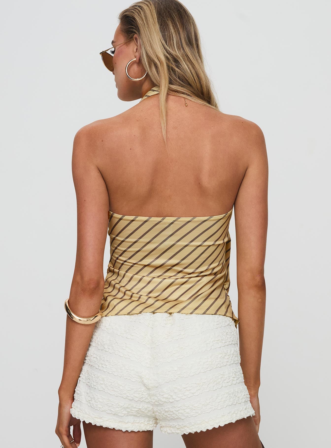 back view of model wearing Princess Polly Fayez Top Diagonal Stripe Yellow Sleeveless Plunger 