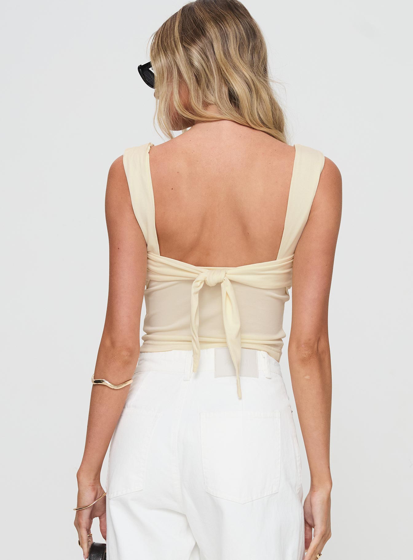 back view of model wearing Princess Polly Francois Backless Top Cream Sleeveless Square Neck 