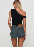 back view of model wearing Princess Polly Get It Right Mid Rise Denim Shorts Dark Denim Wash mid-rise 