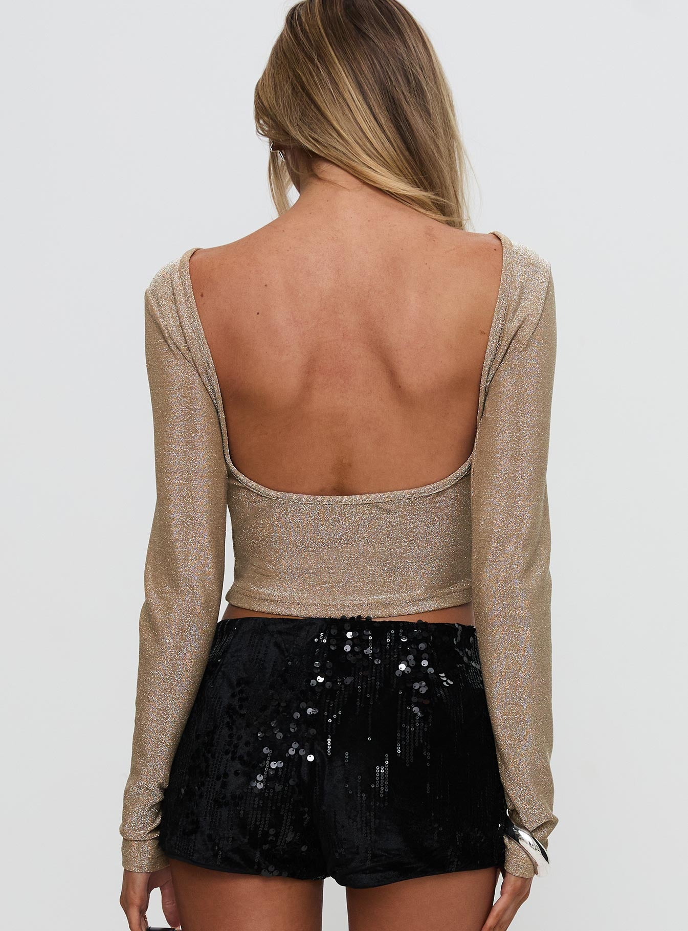 back view of model wearing Princess Polly Amaltheia Long Sleeve Top Gold Full Sleeves Boat Neck 