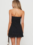 back view of model wearing Princess Polly Molloy Strapless Mini Dress Black Straight Neck 