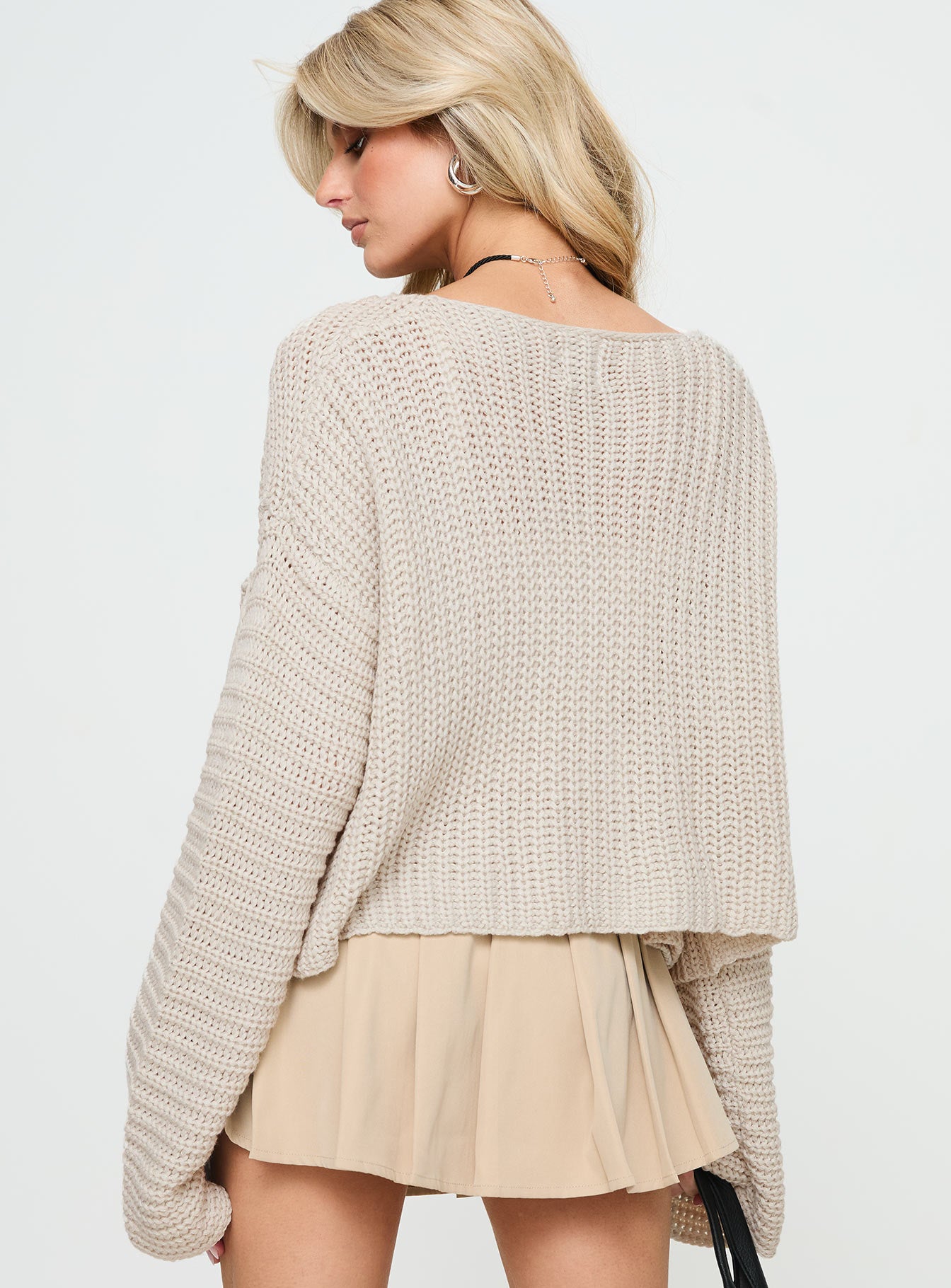 back view of model wearing Princess Polly Artha Cardigan Beige cropped 