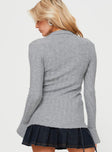 Long sleeve top Ribbed knit material, classic collar, v-neckline, button fastening at front, flared cuffs with slit