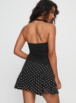 back view of model wearing Princess Polly Godet Mini Skirt Black / White Polka Mini Skirts 