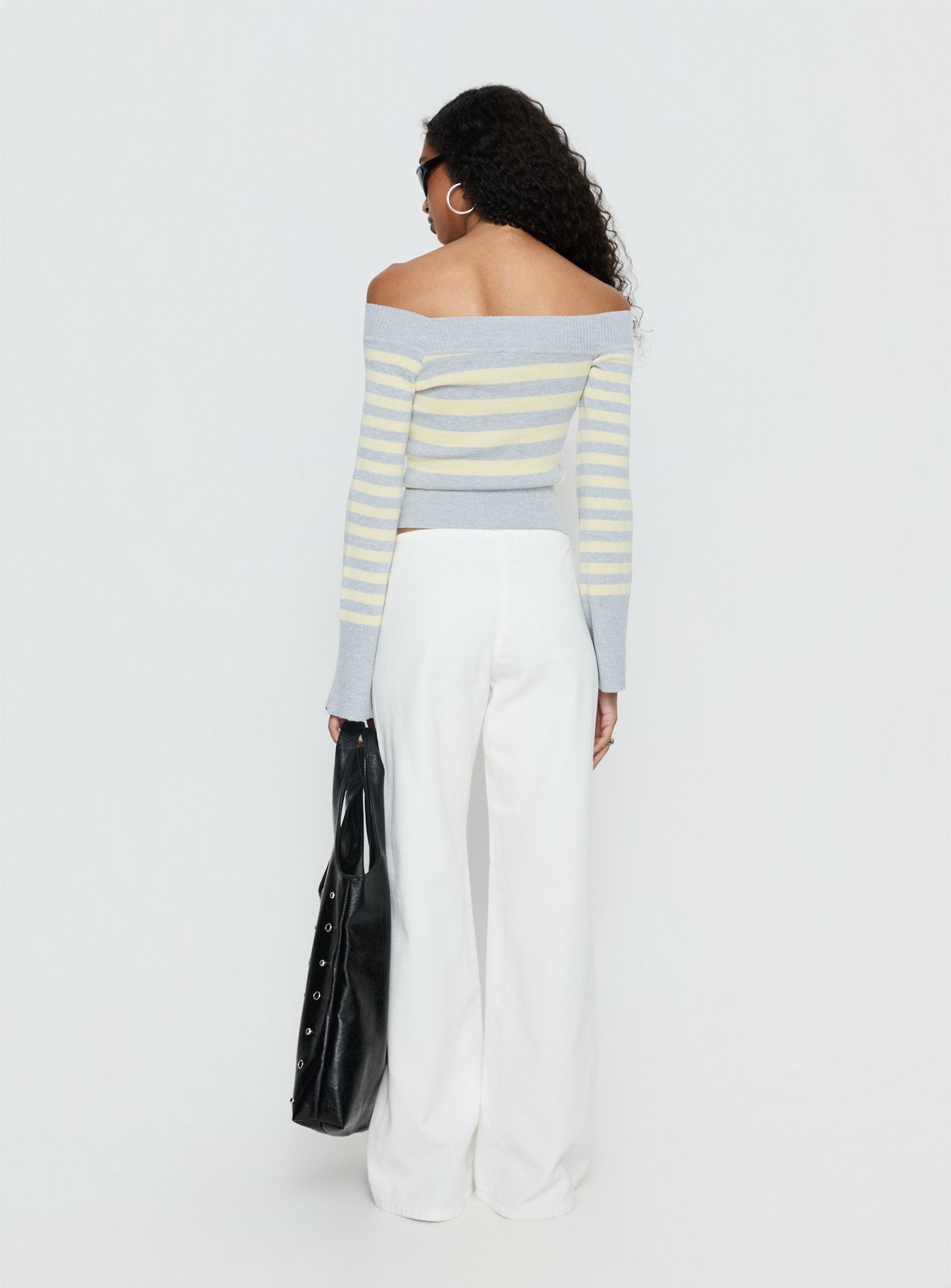 back view of model wearing Princess Polly Hereos Mid Rise Baggy Leg Jeans White Mid Rise Jeans 