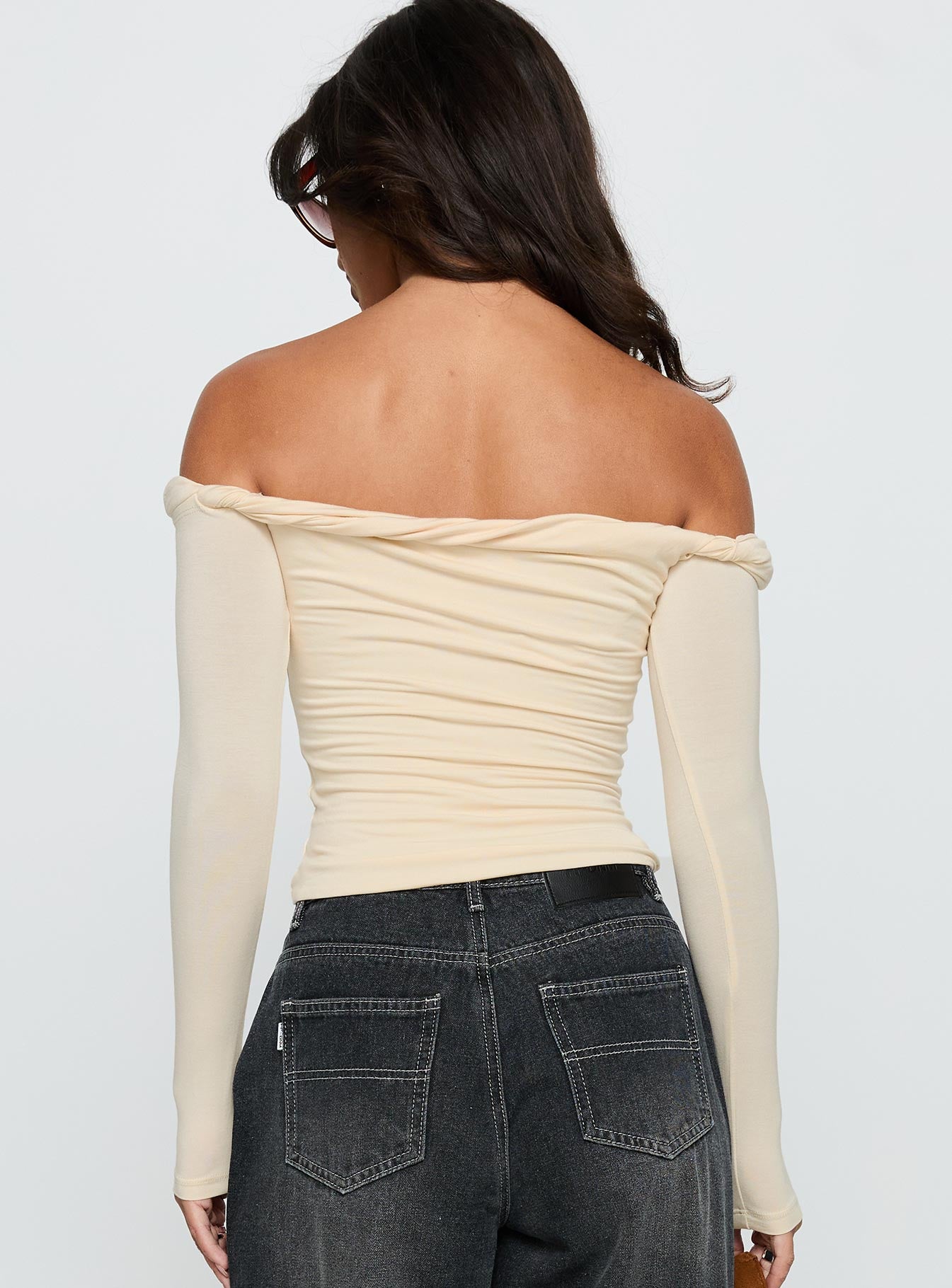 back view of model wearing Princess Polly Dusky Long Sleeve Top Cream Full Sleeves straight 